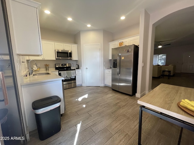 kitchen featuring white cabinetry, sink, and stainless steel appliances