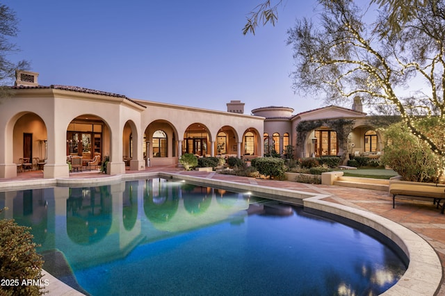 outdoor pool featuring a patio area