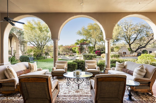 view of patio with ceiling fan and an outdoor living space