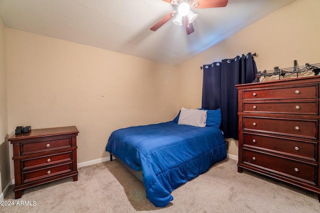 carpeted bedroom featuring lofted ceiling and ceiling fan