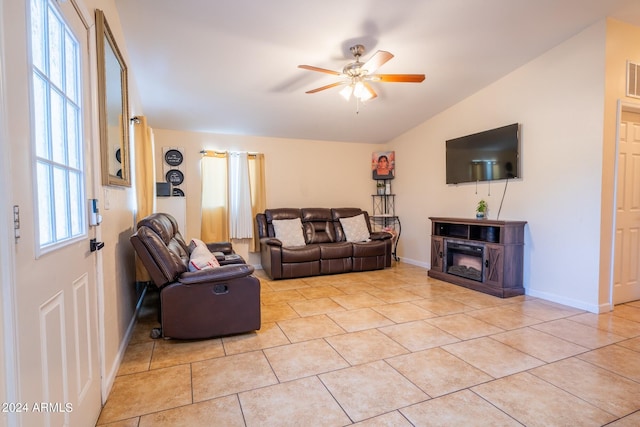 tiled living room featuring vaulted ceiling and ceiling fan