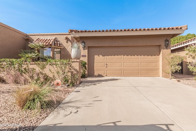 10626 N 8th St, Phoenix, AZ 85020 - view of front of house featuring driveway, stucco siding, and a garage