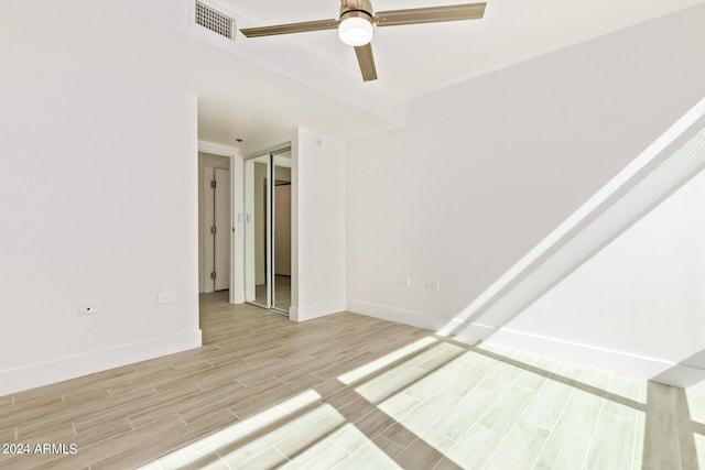 4808 N 24th St Unit 230, Phoenix, AZ 85016 - empty room with ceiling fan, light wood-style flooring, and baseboards