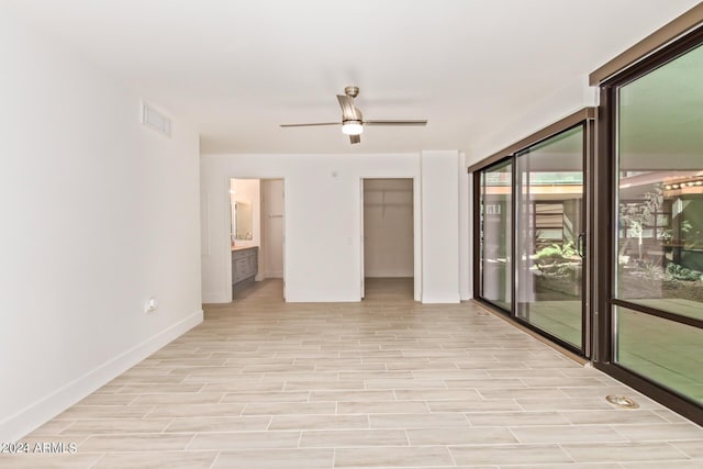 4808 N 24th St Unit 230, Phoenix, AZ 85016 - spare room with baseboards, a ceiling fan, and light wood finished floors