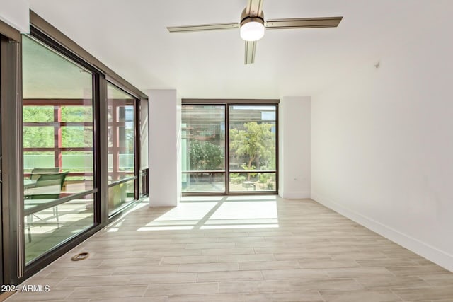 4808 N 24th St Unit 230, Phoenix, AZ 85016 - spare room with a ceiling fan, light wood-type flooring, and baseboards
