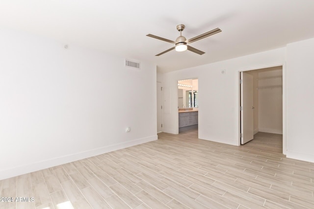 4808 N 24th St Unit 230, Phoenix, AZ 85016 - empty room featuring a ceiling fan, light wood-type flooring, and baseboards
