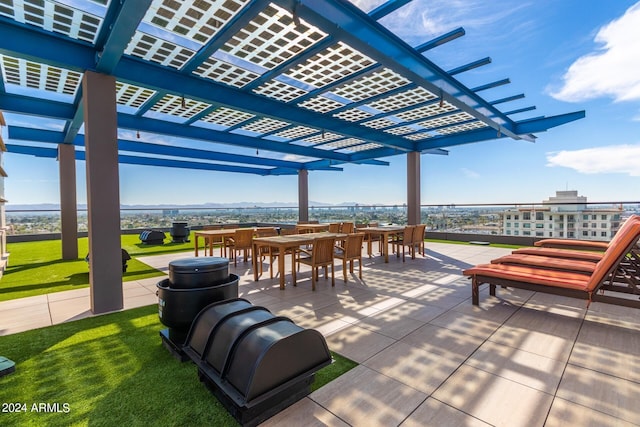 4808 N 24th St Unit 230, Phoenix, AZ 85016 - view of patio / terrace featuring a pergola and outdoor dining area