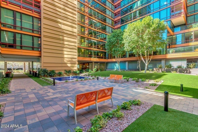 4808 N 24th St Unit 230, Phoenix, AZ 85016 - view of home's community with a patio area and a yard