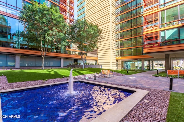 4808 N 24th St Unit 230, Phoenix, AZ 85016 - view of swimming pool with a lawn and a patio