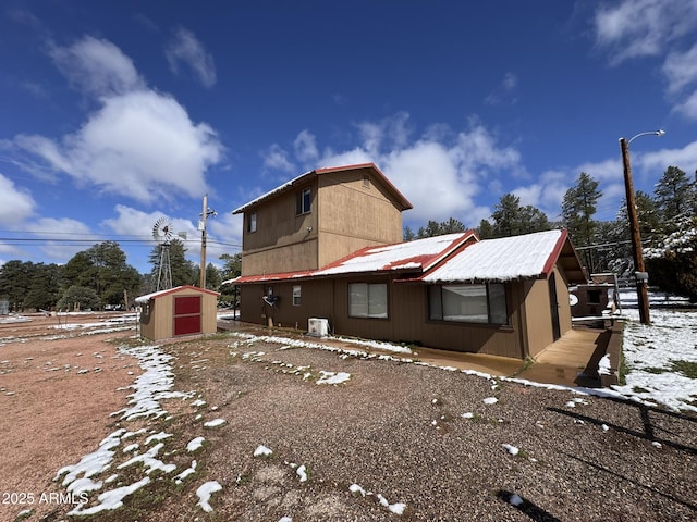 9107 W Fossil Creek Rd, Strawberry, AZ 85544 - view of home's exterior featuring a storage shed and a metal roof