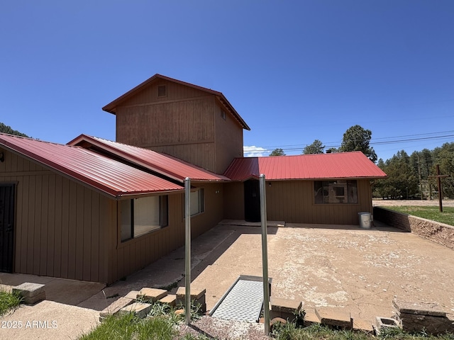 9107 W Fossil Creek Rd, Strawberry, AZ 85544 - back of property featuring a metal roof and a patio
