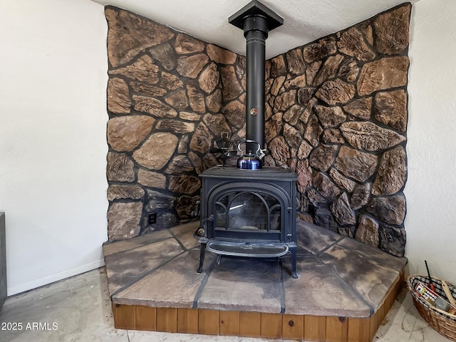 9107 W Fossil Creek Rd, Strawberry, AZ 85544 - detailed view of a wood stove and baseboards