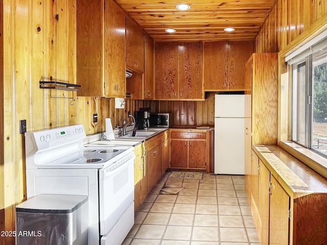 9107 W Fossil Creek Rd, Strawberry, AZ 85544 - kitchen with white appliances, brown cabinets, wooden ceiling, recessed lighting, and light tile patterned floors