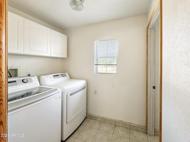 9107 W Fossil Creek Rd, Strawberry, AZ 85544 - laundry room featuring cabinet space, separate washer and dryer, and light tile patterned floors