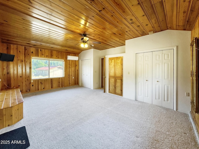 9107 W Fossil Creek Rd, Strawberry, AZ 85544 - unfurnished bedroom featuring multiple closets, carpet floors, wooden ceiling, wood walls, and ceiling fan