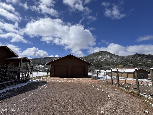 9107 W Fossil Creek Rd, Strawberry, AZ 85544 - view of yard with a mountain view, driveway, an outdoor structure, and a garage