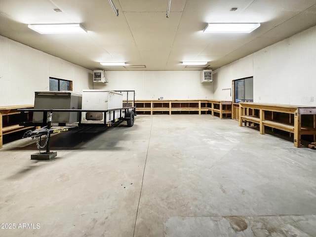 9107 W Fossil Creek Rd, Strawberry, AZ 85544 - garage featuring a workshop area and a heating unit