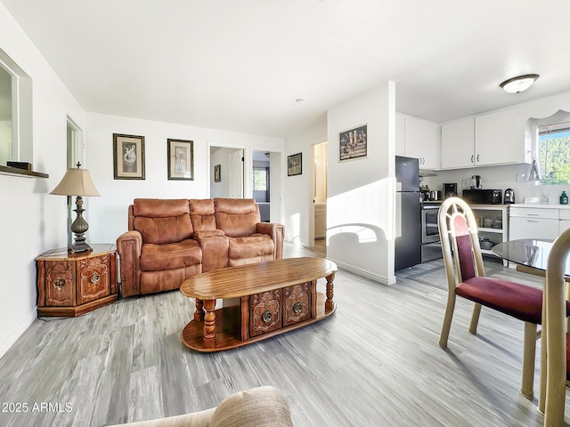 9107 W Fossil Creek Rd, Strawberry, AZ 85544 - living area with light wood-style flooring and baseboards