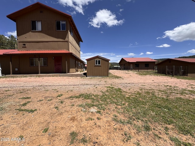 9107 W Fossil Creek Rd, Strawberry, AZ 85544 - back of house featuring a shed