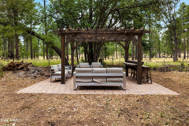 exterior space with an outdoor hangout area and a pergola