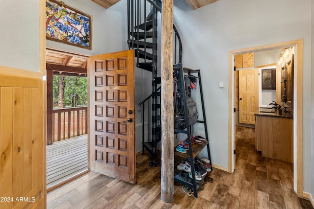 interior space featuring hardwood / wood-style flooring and a towering ceiling