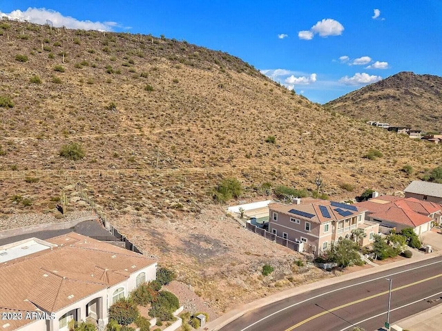 birds eye view of property featuring a mountain view