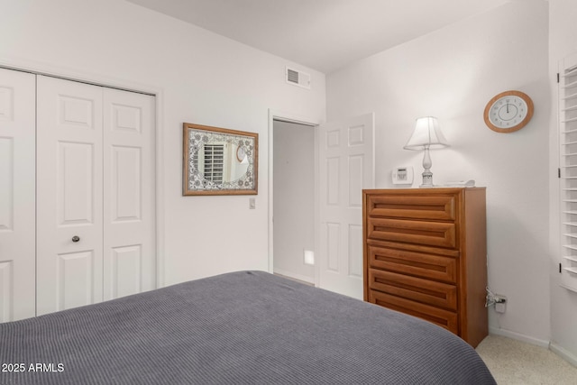 unfurnished bedroom featuring a closet, visible vents, baseboards, and carpet flooring