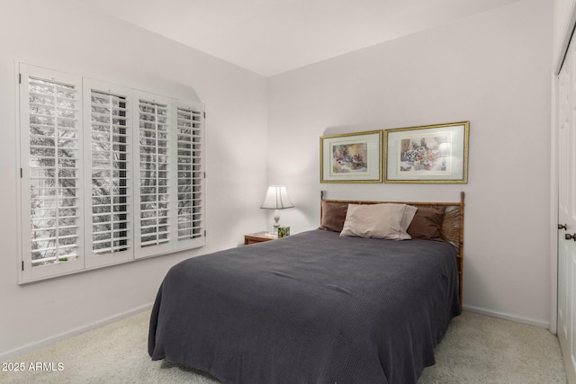 carpeted bedroom with baseboards