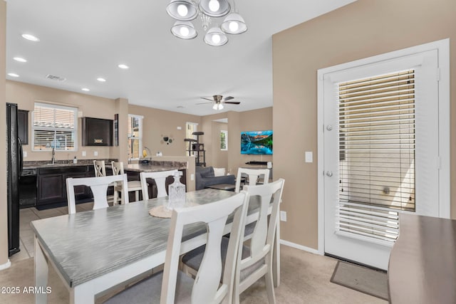 7718 W Pipestone Pl, Phoenix, AZ 85035 - dining room with a ceiling fan, a chandelier, recessed lighting, and baseboards