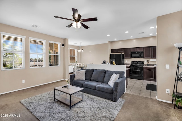 7718 W Pipestone Pl, Phoenix, AZ 85035 - living room featuring light colored carpet, a ceiling fan, baseboards, recessed lighting, and a chandelier
