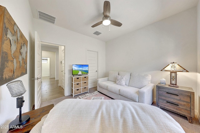 bedroom with a ceiling fan, baseboards, and visible vents