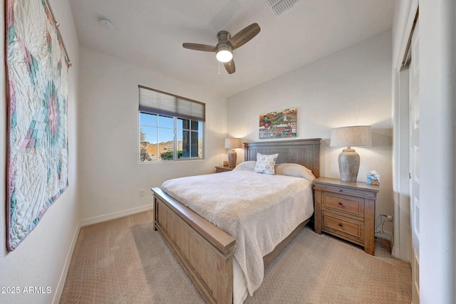 bedroom featuring ceiling fan, baseboards, visible vents, and light carpet