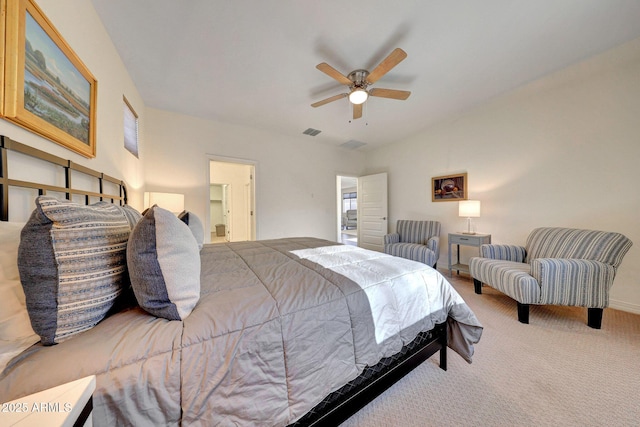 carpeted bedroom featuring visible vents, lofted ceiling, and ceiling fan
