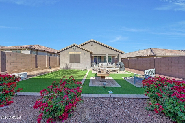 back of property featuring stucco siding, a lawn, a patio, a fenced backyard, and outdoor lounge area