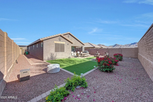 view of yard with a patio and a fenced backyard