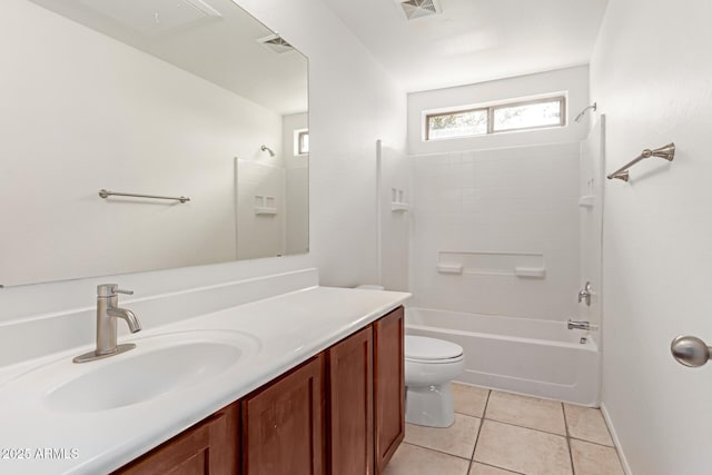 full bathroom featuring vanity, toilet,  shower combination, and tile patterned flooring