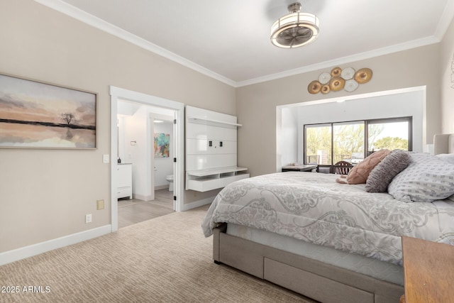 carpeted bedroom with baseboards, connected bathroom, and crown molding