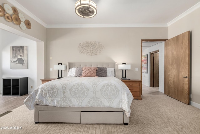 bedroom featuring crown molding