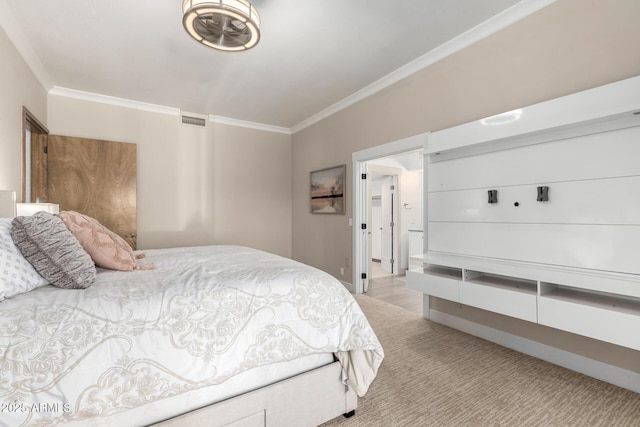 bedroom featuring crown molding, visible vents, and light carpet