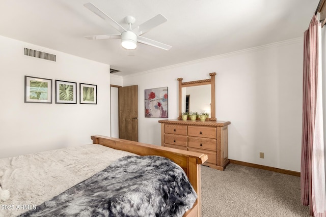 bedroom featuring visible vents, a ceiling fan, ornamental molding, and light carpet