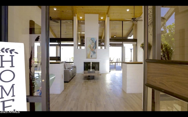 hall featuring wood finished floors and wood ceiling