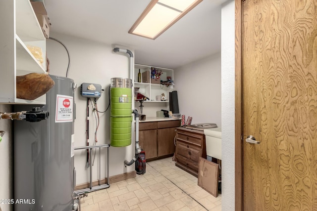 utility room featuring electric water heater