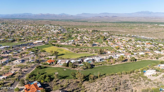 birds eye view of property with a mountain view, a residential view, and view of golf course