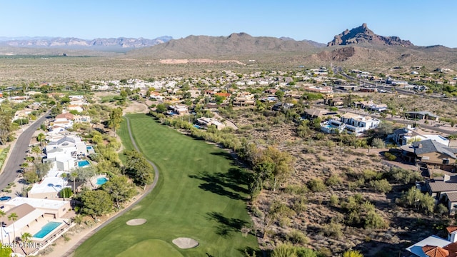 bird's eye view with golf course view, a mountain view, and a residential view
