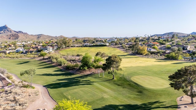 view of property's community with a mountain view, a residential view, and view of golf course
