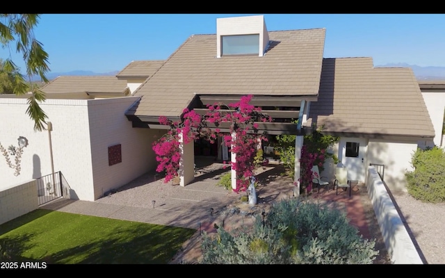 back of house featuring a patio area