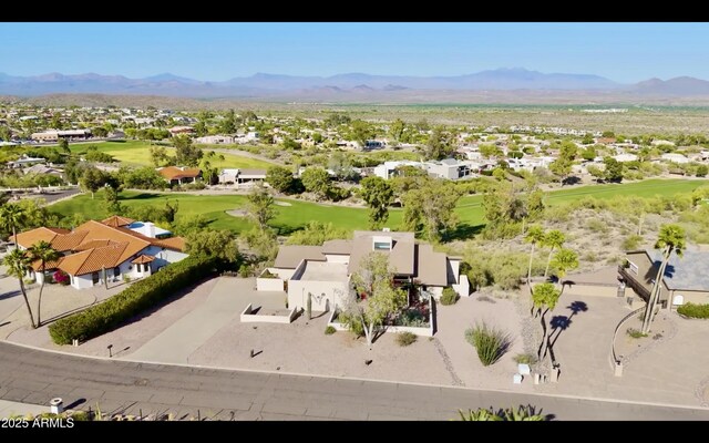 aerial view with a residential view, a mountain view, and golf course view