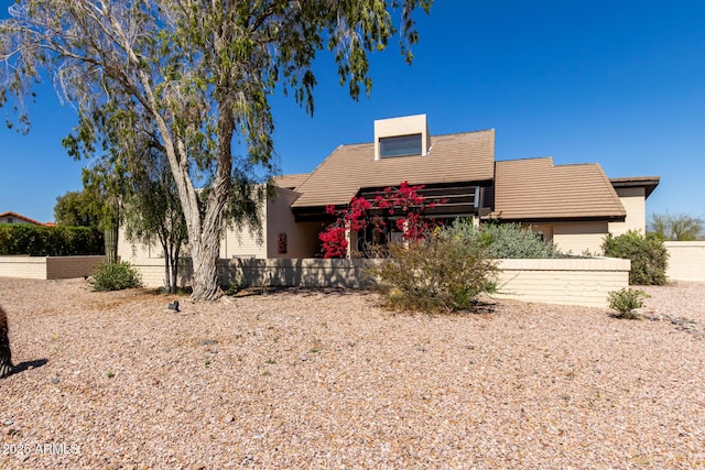 view of front of home with fence