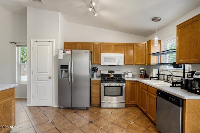 3501 Camino Bella Rosa, Sierra Vista, AZ 85650 - kitchen featuring lofted ceiling, plenty of natural light, light countertops, a sink, and stainless steel appliances
