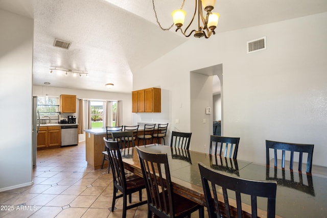3501 Camino Bella Rosa, Sierra Vista, AZ 85650 - dining area featuring visible vents, light tile patterned floors, lofted ceiling, and a notable chandelier